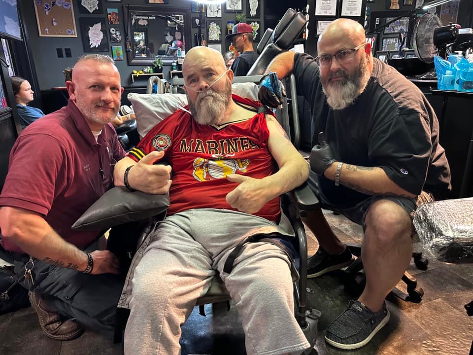 Veteran receiving tattoo
